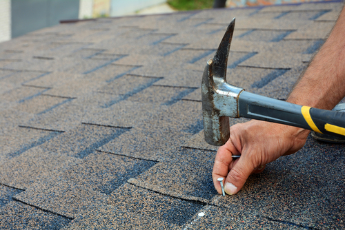Roofer Installing New Roof Shingles
